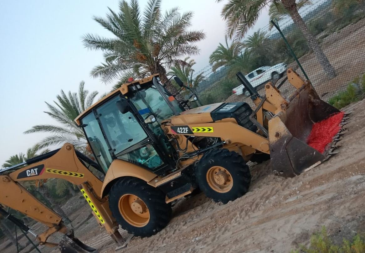 Caterpillar 422F backhoe loader from the Axom Transport fleet on site in Abu Dhabi